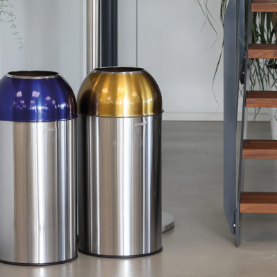 Open Dome blue and yellow selective sorting collectors with a capacity of 40L each and having a brushed stainless steel outer tank as well as a galvanized steel inner tray with their detachable lid.