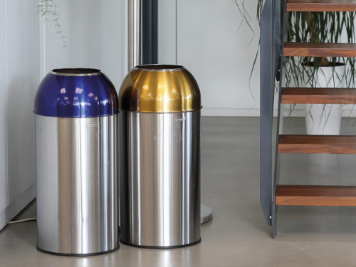 Open Dome blue and yellow selective sorting collectors with a capacity of 40L each and having a brushed stainless steel outer tank as well as a galvanized steel inner tray with their detachable lid.